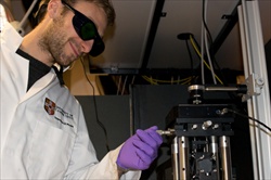 Dr Stefano Pagliara using the PI stage on an optical tweezers setup